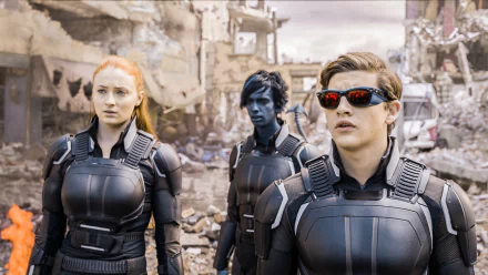 Jean Grey, Cyclops, and Nightcrawler from Marvel's X-Men: Apocalypse stand together in a post-apocalyptic setting, showcasing their distinctive looks and teamwork.
