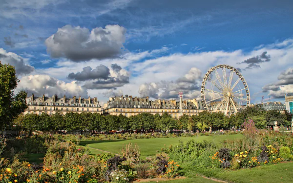 4K Ultra HD PC desktop wallpaper of a Paris garden with colorful flower beds and lawns, a man-made Ferris wheel rising above tree-lined avenues beneath a dramatic cloudy sky.