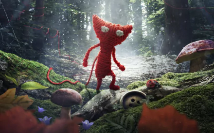 HD PC desktop wallpaper featuring Yarny, the red yarn character from the video game Unravel, standing in a detailed, mossy forest environment.
