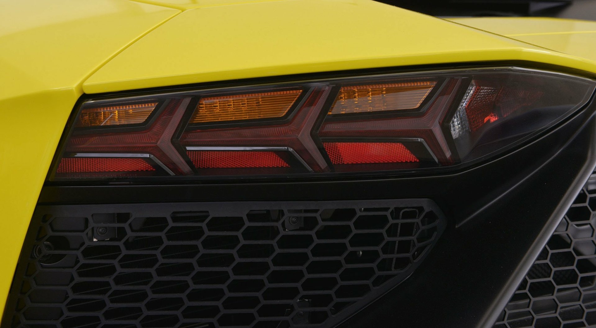 Close-up of a yellow Lamborghini Aventador LP 720-4 50º Anniversario rear taillight and diffuser, HD desktop wallpaper.