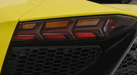 Close-up of a yellow Lamborghini Aventador LP 720-4 50º Anniversario rear taillight and diffuser, HD desktop wallpaper.