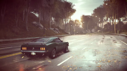 HD PC desktop wallpaper from the video game Need for Speed (2015) featuring a classic muscle car driving on a wet road through a tree-lined landscape at sunset.