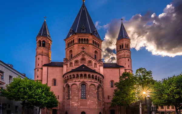 Mainz Cathedral in Germany showcases stunning religious architecture under a vibrant sky, captured in 4K Ultra HD for a striking desktop wallpaper.