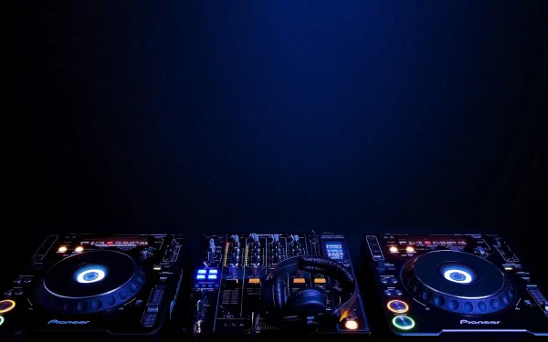 HD desktop wallpaper featuring DJ equipment illuminated against a dark blue background, tagged with trance and music.