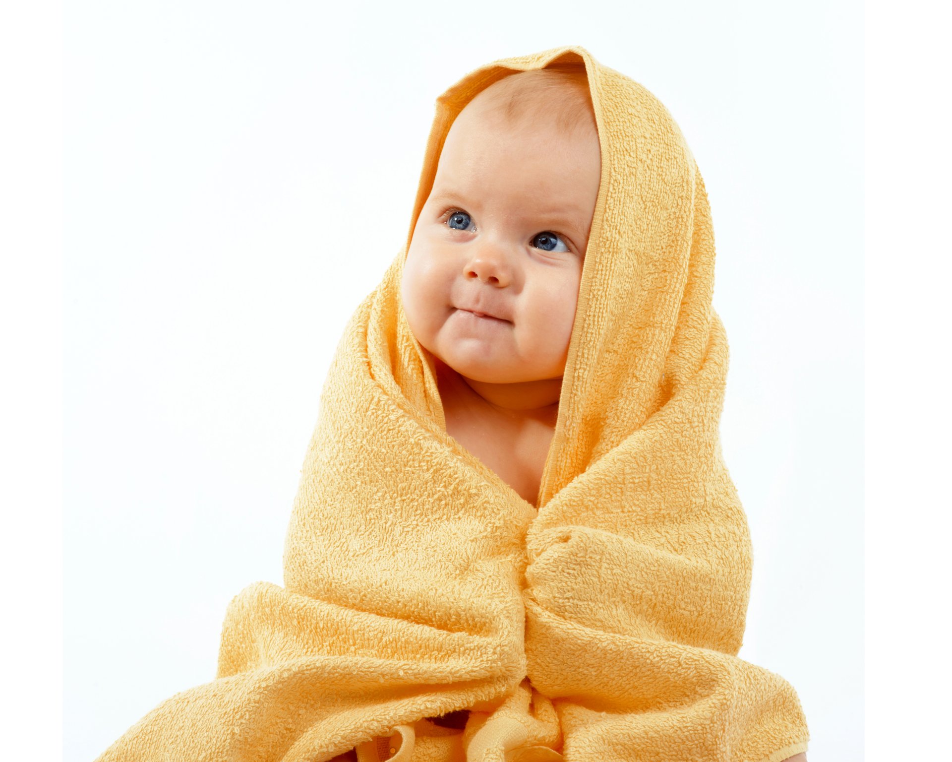 Cute baby with blue eyes smiling, wrapped in a yellow towel — 5K Ultra HD PC desktop wallpaper background photography.