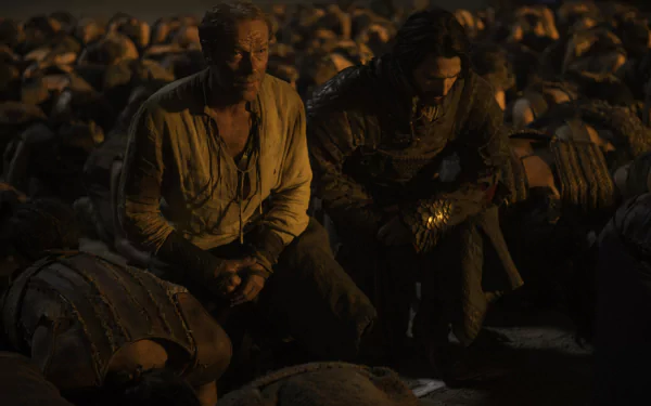 Game of Thrones 2K Quad HD desktop wallpaper: Jorah Mormont and Daario Naharis kneel among fallen soldiers on a dark battlefield.
