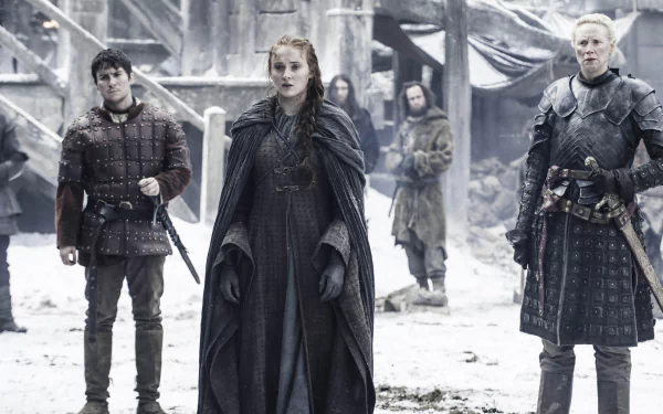 A scene from Game of Thrones featuring Podrick Payne, Sansa Stark, and Brienne of Tarth, set in a snowy landscape, showcasing the show's dramatic atmosphere and character dynamics.