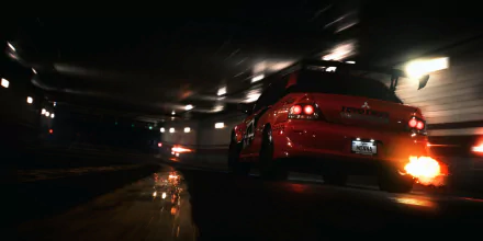 HD PC desktop wallpaper featuring a fiery red car drifting through a dimly lit tunnel from the video game Need For Speed (2015).