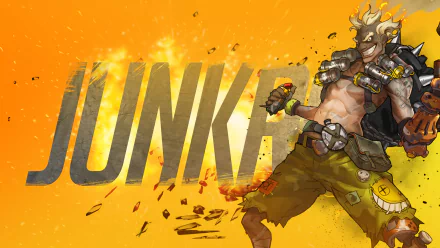 HD desktop wallpaper featuring Junkrat from Overwatch, showcasing his explosive personality against a vibrant orange background with dynamic graphic elements.