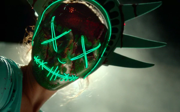 HD PC desktop wallpaper featuring a glowing neon mask inspired by The Purge: Election Year movie, depicting a sinister figure with a Statue of Liberty crown.