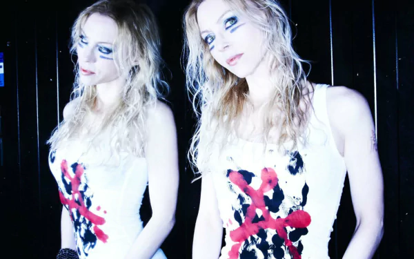 HD PC desktop wallpaper featuring a high-contrast image of a woman with heavy makeup, wearing a white dress with red and black designs, representing music and Arch Enemy.