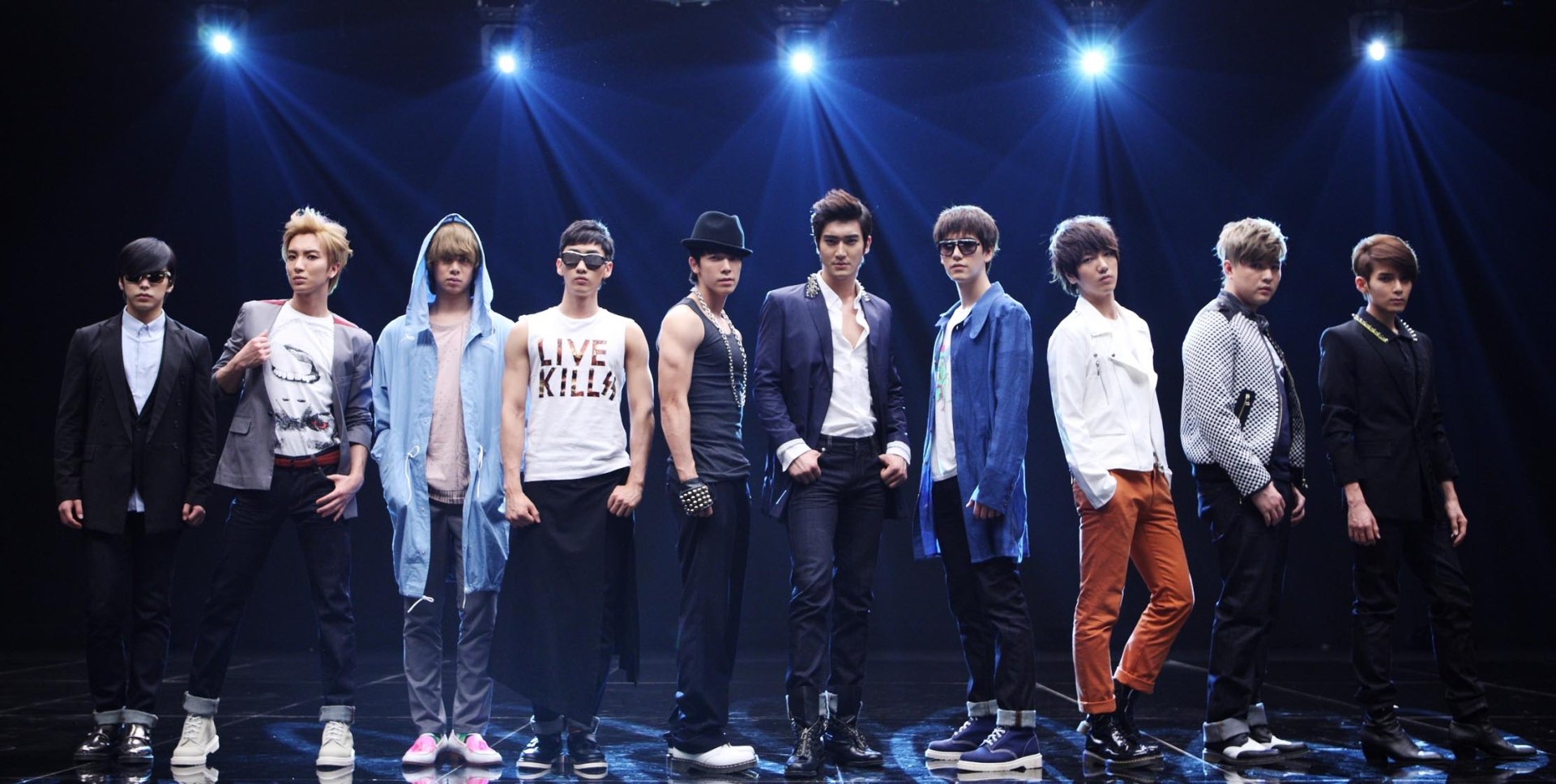 HD wallpaper featuring the Super Junior band posing together on stage for a desktop background.