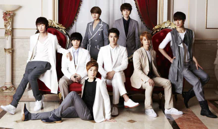 HD desktop wallpaper featuring the members of Super Junior dressed in stylish attire, posing elegantly in a luxurious room.