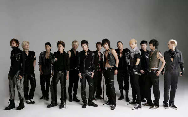A high-definition wallpaper featuring the K-pop group Super Junior, showcasing the members in stylish outfits against a simple backdrop, exuding a cool and dynamic energy.