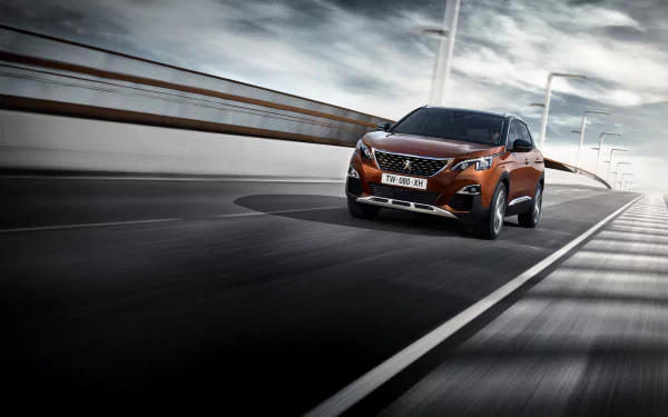 Orange Peugeot 3008 SUV driving on a modern road, captured in a high-resolution 4K Ultra HD desktop wallpaper.