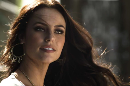 Close-up of Brazilian model Paola Oliveira with brunette hair, wearing large earrings, captured in 4K Ultra HD for a PC desktop wallpaper and background.