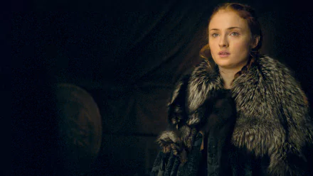 Sansa Stark, portrayed by Sophie Turner, appears contemplative in this striking HD wallpaper from the TV show Game of Thrones, showcasing her character's depth and resilience.