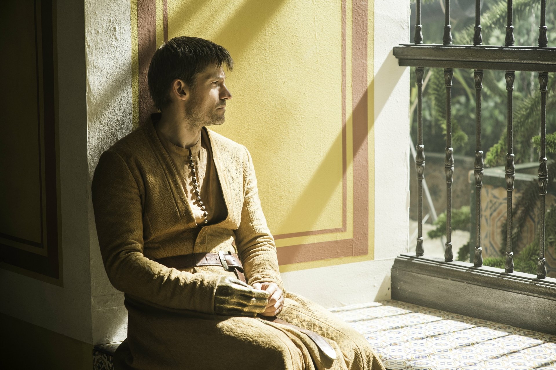 Jaime Lannister from the TV show Game of Thrones sits by a sunlit window in medieval garb — 4K Ultra HD PC desktop wallpaper and background.