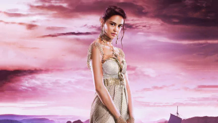 A striking HD desktop wallpaper from the movie *Gods of Egypt*, featuring a character in elegant attire against a vibrant purple sky.