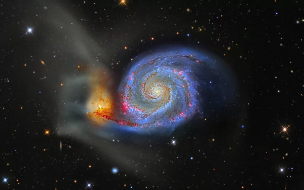 A vibrant sci-fi galaxy with swirling blue and orange hues, captured in stunning 4K Ultra HD for a dynamic PC desktop wallpaper and background.