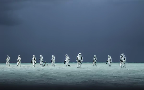 HD wallpaper from Rogue One: A Star Wars Story featuring stormtroopers on a beach under a dark, stormy sky.