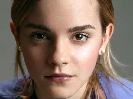 Close-up portrait of Emma Watson, featuring soft lighting and a neutral background, designed as a high-definition PC desktop wallpaper.