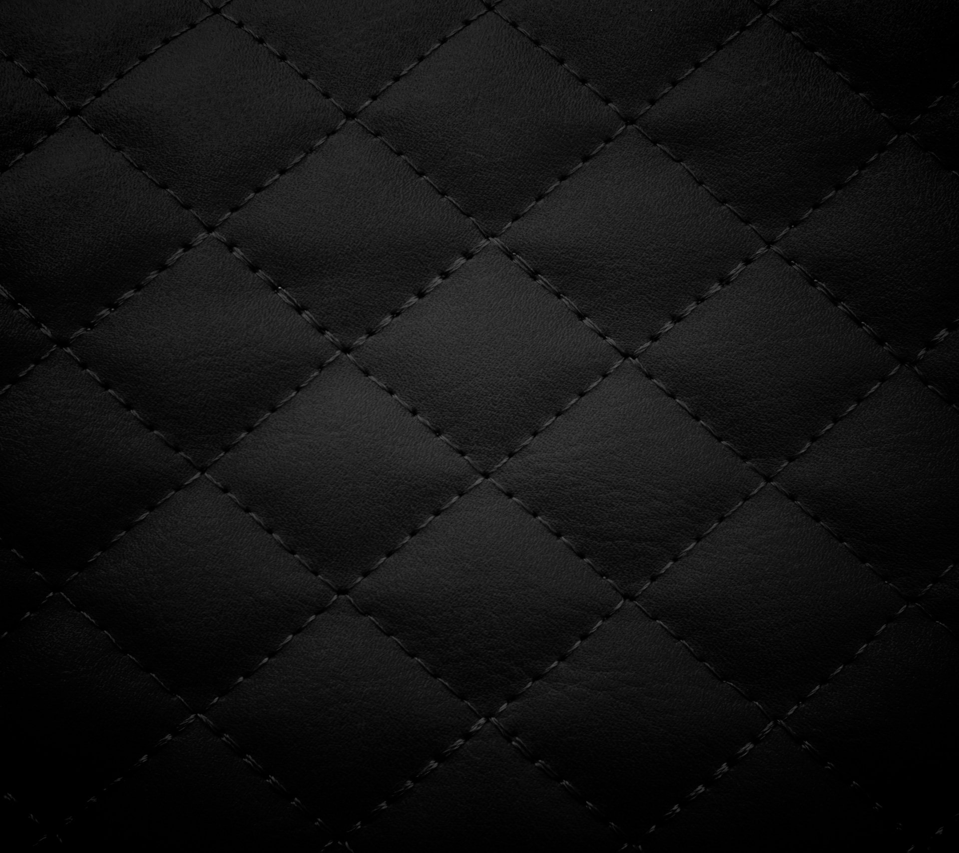 Abstract square quilted pattern in dark charcoal with stitched diamond grid texture — 2K Quad HD PC desktop wallpaper background.