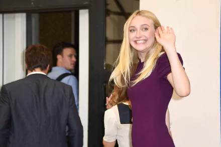 Celebrity Dakota Fanning waves and smiles, featured in a sharp 4K Ultra HD PC desktop wallpaper and background.