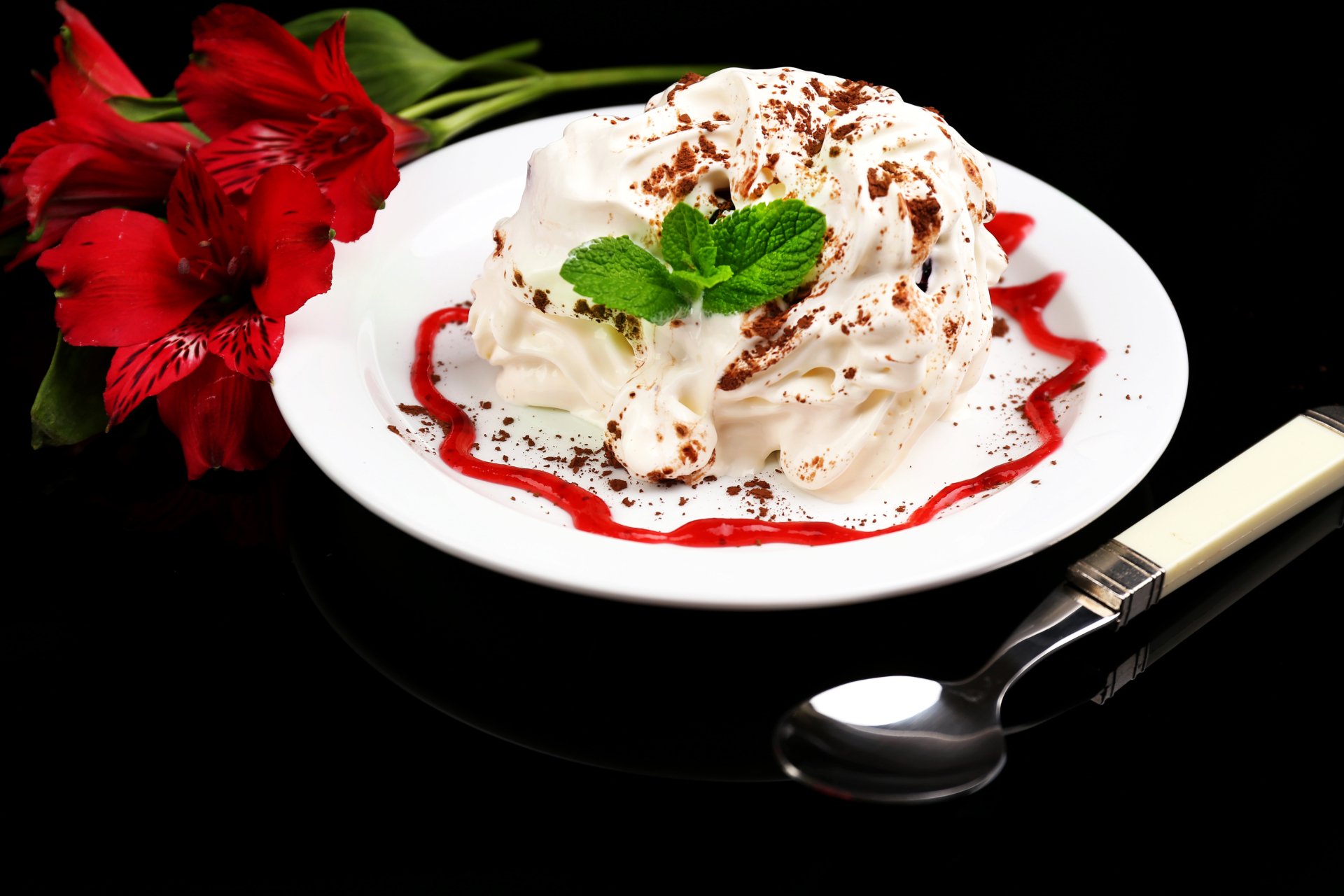 A 4K Ultra HD desktop wallpaper featuring a plate of ice cream garnished with mint leaves and red flower petals on a black background.