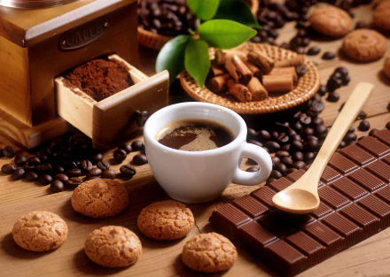 A cozy arrangement of coffee beans, a steaming cup of coffee, chocolate, and biscuits, set against a backdrop of rich textures and warm tones, creating an inviting food scene.