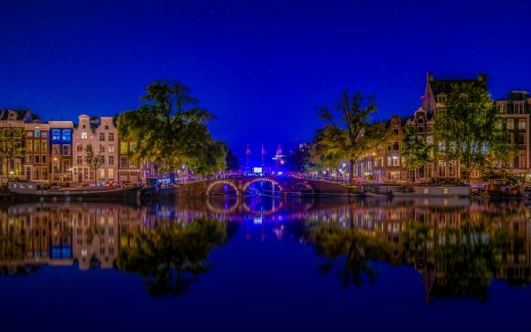 Man Made Amsterdam Cities Netherlands River Bridge Building Reflection Night City HD Wallpaper | Background Image
