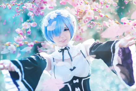 A vibrant HD wallpaper featuring Rem from Re:Zero - Starting Life in Another World, portrayed by a woman in cosplay amidst blossoming cherry trees, exuding a magical atmosphere.
