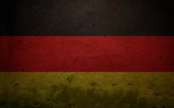 A textured HD wallpaper featuring the flag of Germany, showcasing the iconic black, red, and yellow stripes against a rugged background.