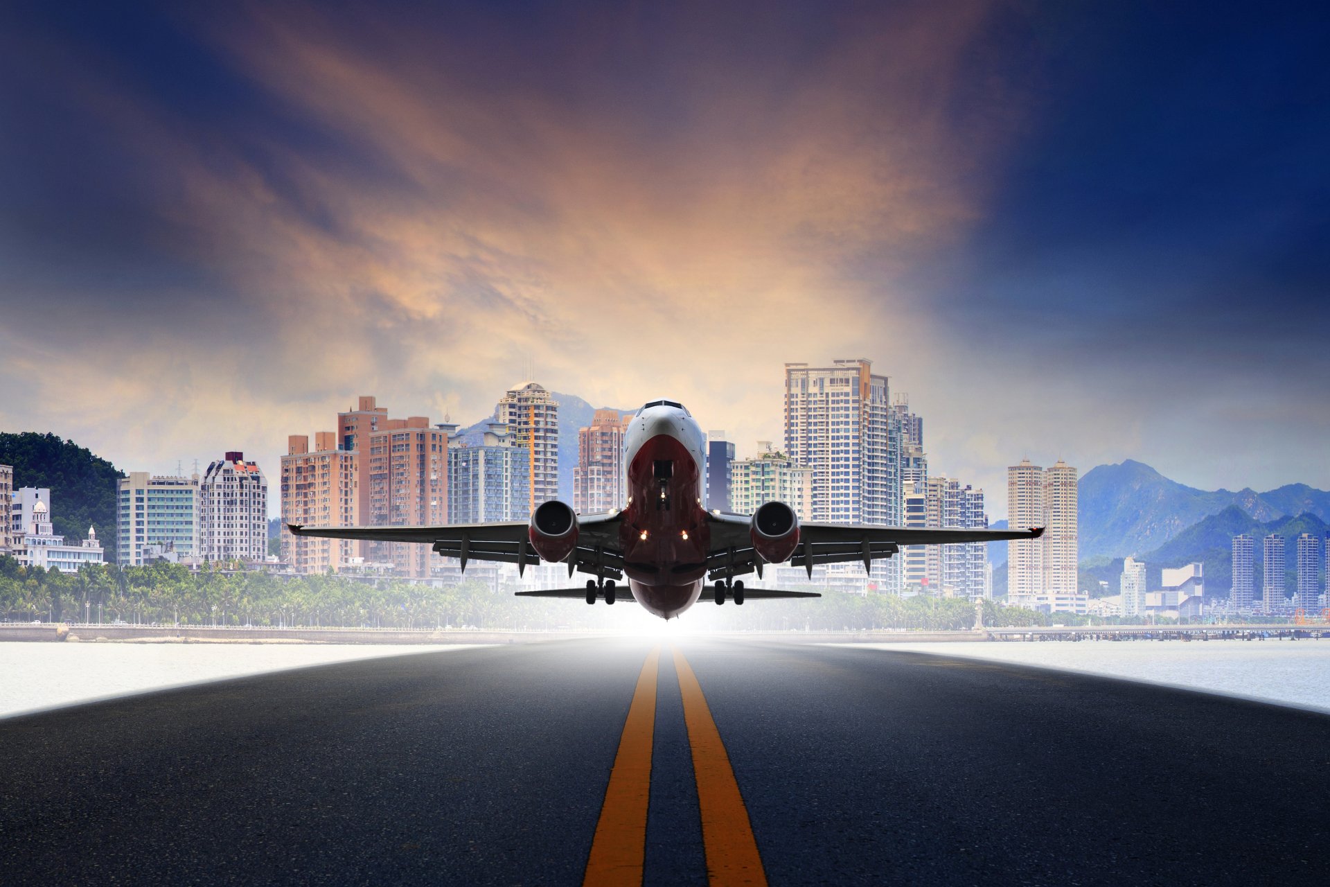 4K Ultra HD PC desktop wallpaper: a digitally manipulated image of a passenger aircraft/vehicle lifting off toward a city skyline, dramatic sunrise behind the silhouette on the runway.