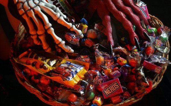 Holiday Halloween Candy Hand Skeleton HD Wallpaper | Background Image