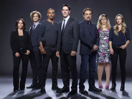 A group of six characters from the TV show Criminal Minds, posed confidently against a dark backdrop. This HD wallpaper captures their distinct personalities and team dynamic.