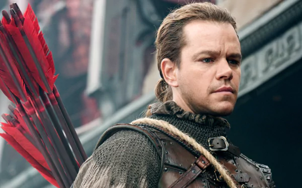 Matt Damon in a scene from the movie The Great Wall, featuring him in medieval armor with a quiver of arrows, set against a dramatic backdrop. HD desktop wallpaper.