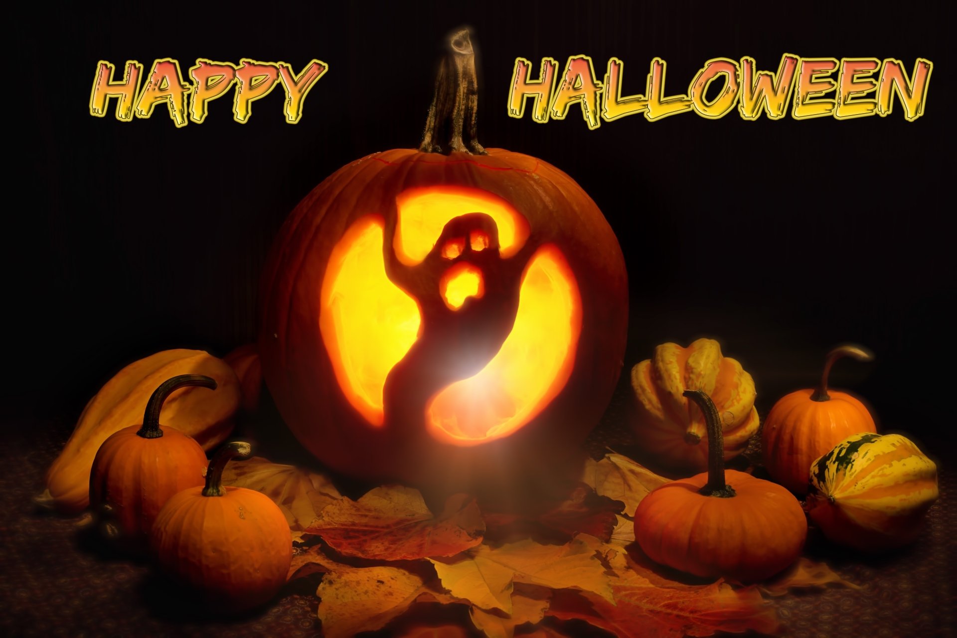 A glowing jack-o'-lantern with a ghost carving surrounded by pumpkins and autumn leaves, with Happy Halloween text, in a 4K Ultra HD Halloween-themed desktop wallpaper.