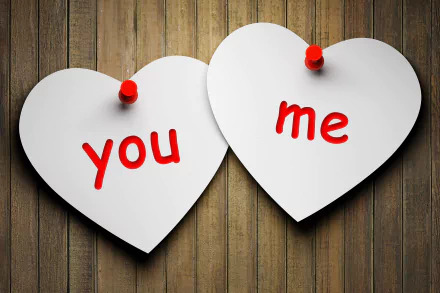 HD desktop wallpaper featuring two white heart-shaped notes pinned to a wooden background, with you and me written in red. The artistic image embodies a romantic and loving theme.