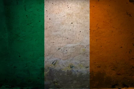 HD PC desktop wallpaper featuring the grunge-style Flag of Ireland with vertical green, white, and orange stripes on a textured background.