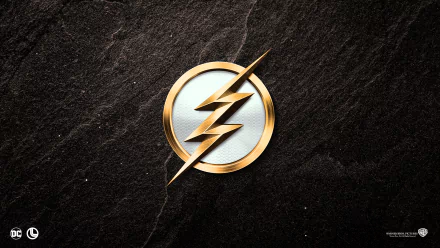 A stylish HD desktop wallpaper featuring the logo of the movie The Flash (2018) set against a textured dark background.