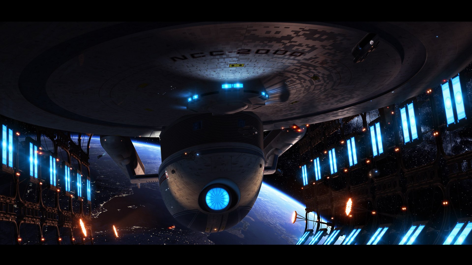 HD wallpaper featuring the USS Excelsior from Star Trek, set against a backdrop of space with glowing lights, encapsulating a vibrant sci-fi atmosphere.