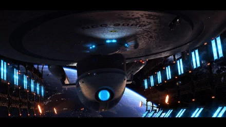 HD wallpaper featuring the USS Excelsior from Star Trek, set against a backdrop of space with glowing lights, encapsulating a vibrant sci-fi atmosphere.