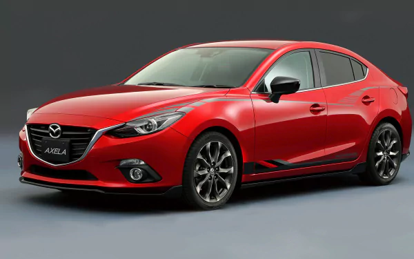 Red Mazda 3 compact car on a neutral background, glossy hatchback profile — 2K Quad HD PC desktop wallpaper of a Mazda vehicle.