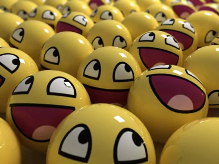 A vibrant HD desktop wallpaper featuring a cluster of 3D yellow smiley balls with various funny expressions.