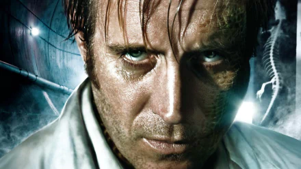 HD wallpaper featuring a close-up of a character from the movie The Amazing Spider-Man, with a grim expression and reptilian features in a dark, industrial background.