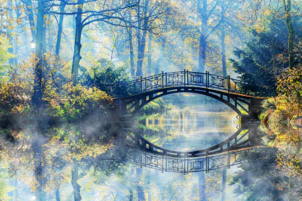 HD desktop wallpaper featuring a serene nature scene with a river, a bridge reflecting in the water, sunbeams filtering through trees in a park. Beautiful photography capturing tranquility.