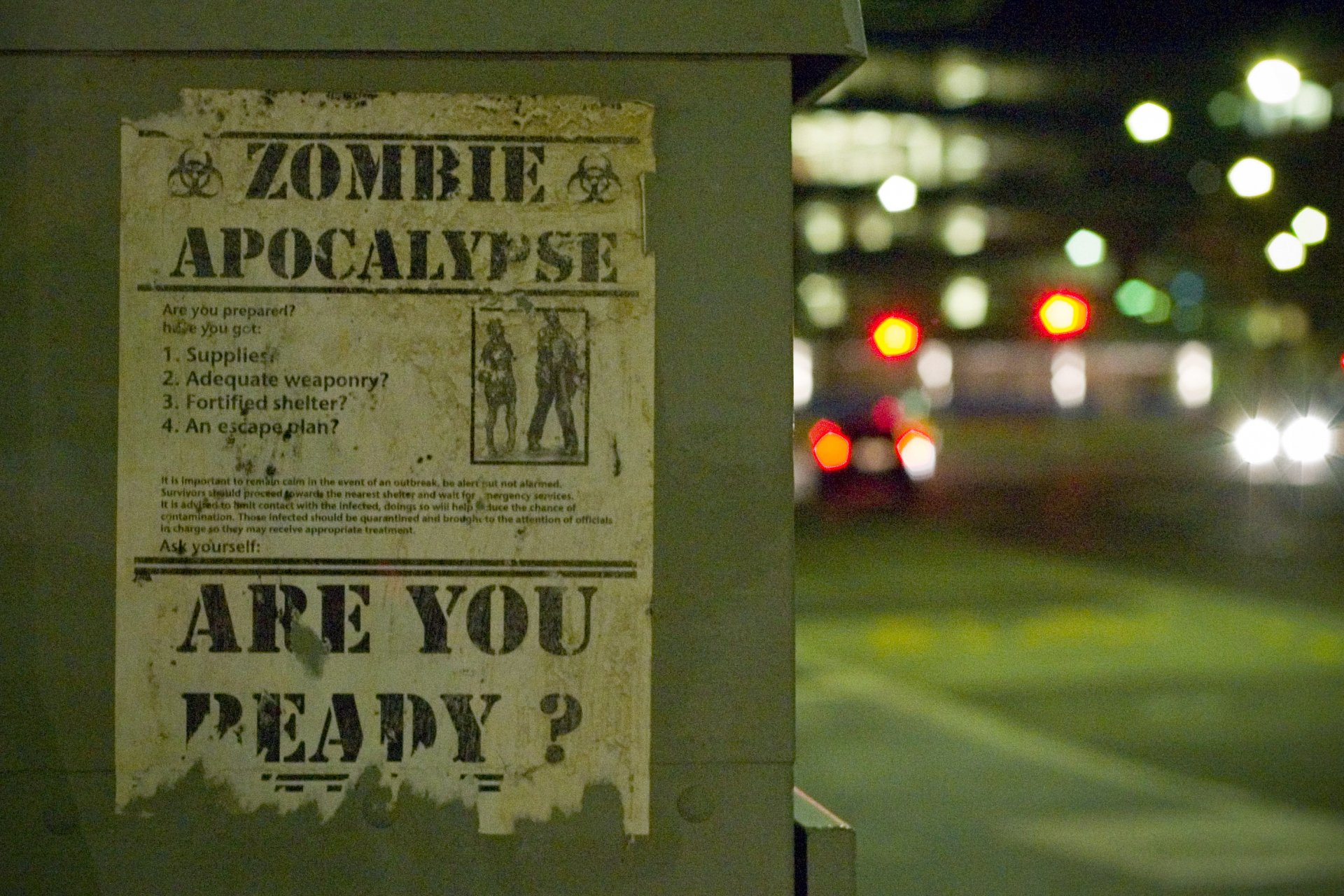 A dark, atmospheric HD desktop wallpaper featuring a weathered poster about a zombie apocalypse, inviting viewers to consider their readiness for the impending threat.