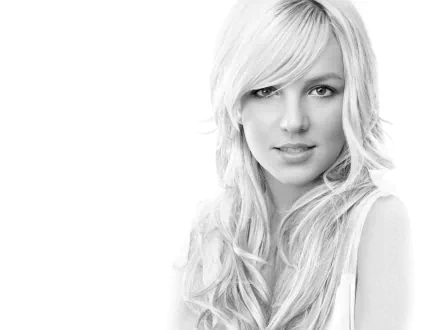HD desktop wallpaper featuring pop music icon Britney Spears in a close-up portrait with a soft, monochrome aesthetic.