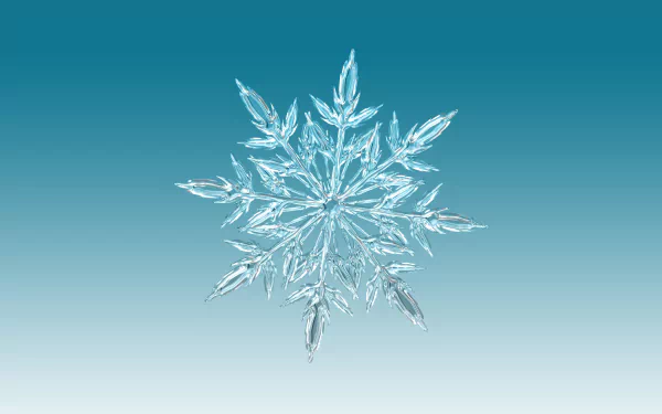 Artistic close-up of a detailed snowflake against a gradient blue background, rendered in 4K Ultra HD for a crisp PC desktop wallpaper.